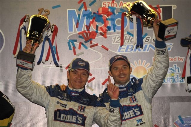 Adrian Fernandez, left, and his racing teammate, Luis Diaz, savor their win at the 12 Hours of Sebring Race on March 21 in Florida