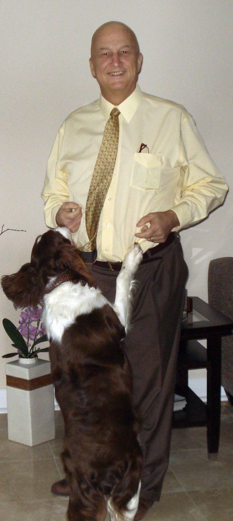 Ron Wilson in his home with his dog