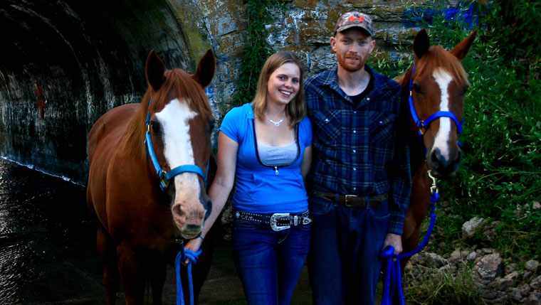 Joshua Russell and his fiancé, Ashley, take a break during a horse ride. 