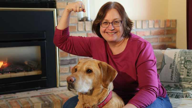 Jane Jacobs, colon cancer survivor, poses for a strong arm selfie.