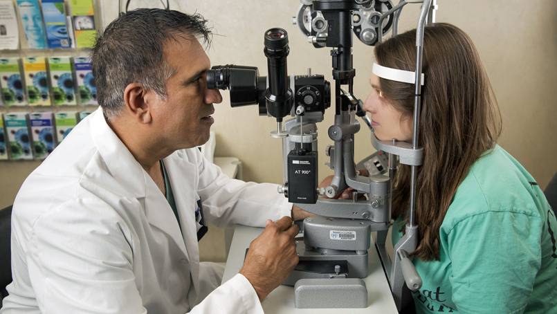 Brianna Bosley gets an eye exam from Dr. Dave Patel. 