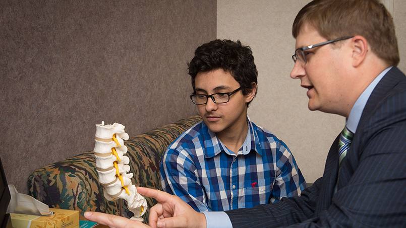 When the position of his spine unexpectedly changed, 13-year-old Albert Mansour was unable to walk without discomfort. Using a unique surgical approach, Mayo Clinic surgeons were able to successfully repair Albert's spine and relieve his pain.