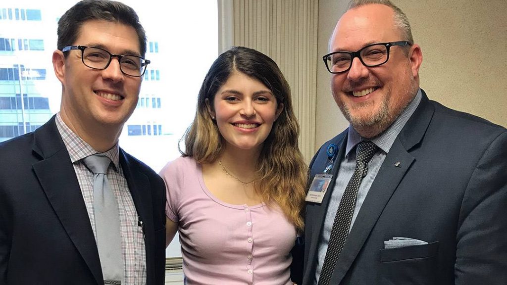 Carys Rees-Baker with Jonathan Fillmore, M.D., D.M.D., and Chad Rasmussen, D.D.S. 
